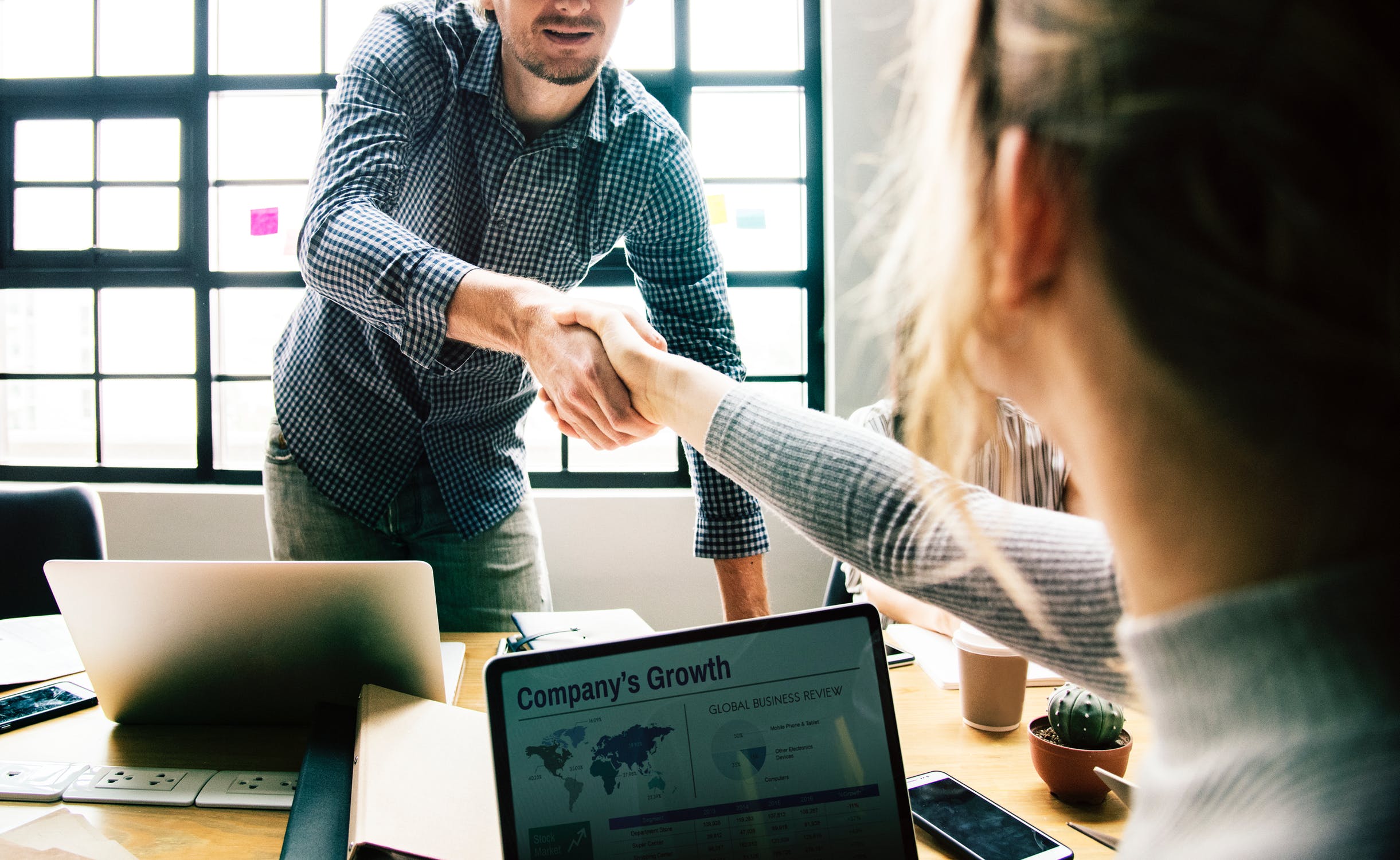 Stock photo of people shaking hands